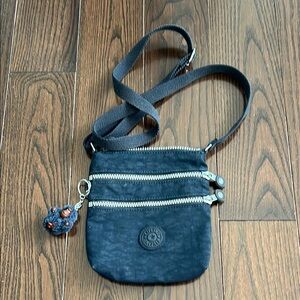 Kipling Blue Crossbody Bag with Adjustable Straps and Signature Charm